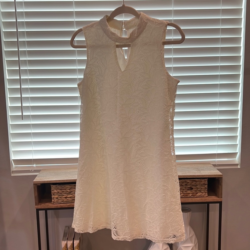 As U Wish’s ivory above the knee dress. Size M.